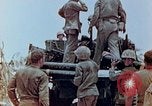 Image of U.S. marines set up camouflaged artillery  Saipan Northern Mariana Islands, 1944, second 3 stock footage video 65675028054