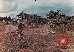 Standbild US Marine wirft Handgranate Saipan Nördliche Marianen, 1944, aus Sekunde 20 historischem Filmmaterial Videoclip 65675028058
