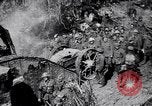 Image of British Mark I tank (male) followed by Allied troops France, 1916, second 23 stock footage video 65675028139