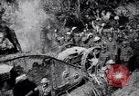 Image of British Mark I tank (male) followed by Allied troops France, 1916, second 25 stock footage video 65675028139