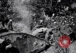 Image of British Mark I tank (male) followed by Allied troops France, 1916, second 27 stock footage video 65675028139