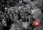 Image of British Mark I tank (male) followed by Allied troops France, 1916, second 39 stock footage video 65675028139