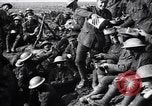 Image of British Mark I tank (male) followed by Allied troops France, 1916, second 52 stock footage video 65675028139