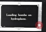 Image of loading bombs aboard a French hydroplane France, 1918, second 1 stock footage video 65675028152