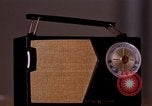 Image of transistor radio United States USA, 1961, second 3 stock footage video 65675028236