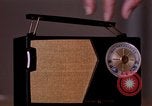 Image of transistor radio United States USA, 1961, second 4 stock footage video 65675028236