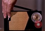 Image of transistor radio United States USA, 1961, second 7 stock footage video 65675028236