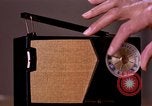 Image of transistor radio United States USA, 1961, second 10 stock footage video 65675028236