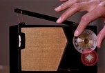 Image of transistor radio United States USA, 1961, second 11 stock footage video 65675028236