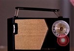 Image of transistor radio United States USA, 1961, second 15 stock footage video 65675028236