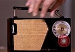 Image of transistor radio United States USA, 1961, second 22 stock footage video 65675028236