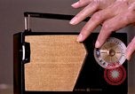 Image of transistor radio United States USA, 1961, second 24 stock footage video 65675028236