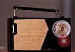 Image of transistor radio United States USA, 1961, second 27 stock footage video 65675028236