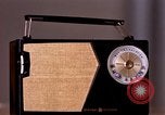 Image of transistor radio United States USA, 1961, second 28 stock footage video 65675028236