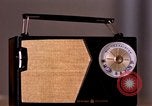 Image of transistor radio United States USA, 1961, second 29 stock footage video 65675028236