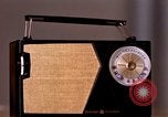 Image of transistor radio United States USA, 1961, second 30 stock footage video 65675028236