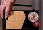 Image of transistor radio United States USA, 1961, second 32 stock footage video 65675028236