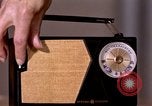 Image of transistor radio United States USA, 1961, second 33 stock footage video 65675028236