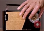 Image of transistor radio United States USA, 1961, second 35 stock footage video 65675028236