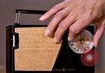 Image of transistor radio United States USA, 1961, second 36 stock footage video 65675028236