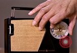 Image of transistor radio United States USA, 1961, second 37 stock footage video 65675028236