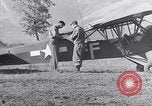 Image of piper cub Pacific Theater, 1944, second 37 stock footage video 65675028378