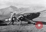 Image of piper cub Pacific Theater, 1944, second 42 stock footage video 65675028378