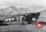Image of piper cub Pacific Theater, 1944, second 43 stock footage video 65675028378