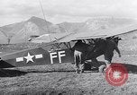 Image of piper cub Pacific Theater, 1944, second 44 stock footage video 65675028378