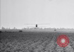 Image of a crop duster in action United States USA, 1926, second 1 stock footage video 65675028403
