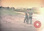 Image of sentry dog patrolling field Tan Son Nhut Air Force Base Vietnam, 1965, second 1 stock footage video 65675028506