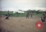 Image of sentry dog patrolling field Tan Son Nhut Air Force Base Vietnam, 1965, second 5 stock footage video 65675028506