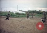 Image of sentry dog patrolling field Tan Son Nhut Air Force Base Vietnam, 1965, second 6 stock footage video 65675028506