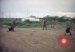 Image of sentry dog patrolling field Tan Son Nhut Air Force Base Vietnam, 1965, second 8 stock footage video 65675028506