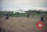 Image of sentry dog patrolling field Tan Son Nhut Air Force Base Vietnam, 1965, second 10 stock footage video 65675028506