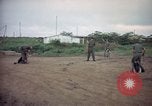 Image of sentry dog patrolling field Tan Son Nhut Air Force Base Vietnam, 1965, second 11 stock footage video 65675028506