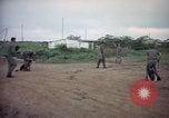 Image of sentry dog patrolling field Tan Son Nhut Air Force Base Vietnam, 1965, second 12 stock footage video 65675028506