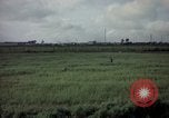 Image of sentry dog patrolling field Tan Son Nhut Air Force Base Vietnam, 1965, second 27 stock footage video 65675028506