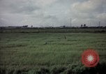 Image of sentry dog patrolling field Tan Son Nhut Air Force Base Vietnam, 1965, second 30 stock footage video 65675028506