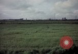 Image of sentry dog patrolling field Tan Son Nhut Air Force Base Vietnam, 1965, second 31 stock footage video 65675028506