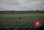 Image of sentry dog patrolling field Tan Son Nhut Air Force Base Vietnam, 1965, second 51 stock footage video 65675028506