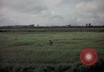 Image of sentry dog patrolling field Tan Son Nhut Air Force Base Vietnam, 1965, second 52 stock footage video 65675028506