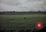 Image of sentry dog patrolling field Tan Son Nhut Air Force Base Vietnam, 1965, second 55 stock footage video 65675028506