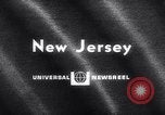 Image of fire on riverfront New Jersey United States USA, 1964, second 5 stock footage video 65675028591