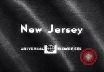 Image of fire on riverfront New Jersey United States USA, 1964, second 6 stock footage video 65675028591