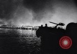 Image of fire on riverfront New Jersey United States USA, 1964, second 8 stock footage video 65675028591