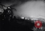 Image of fire on riverfront New Jersey United States USA, 1964, second 34 stock footage video 65675028591