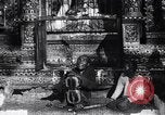 Image of Man sings and plays a saranqi at a temple India, 1953, second 11 stock footage video 65675028606