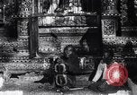 Image of Man sings and plays a saranqi at a temple India, 1953, second 13 stock footage video 65675028606