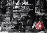 Image of Man sings and plays a saranqi at a temple India, 1953, second 18 stock footage video 65675028606